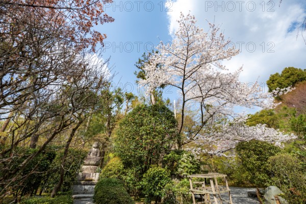 Small Buddha statue in the garden, Ryoan-ji Temple, Ryoan-ji, Zen Buddhist temple complex, Kyoto, Japan