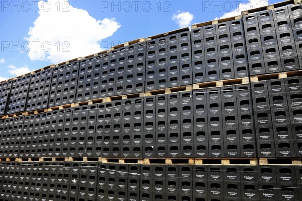 Stacked black beer crates from the Kulmbacher Group, a beverage manufacturer that includes Kulmbacher Brauerei AG and other breweries such as Sternquell, Braustolz and Würzburger Hofbräu, editorial