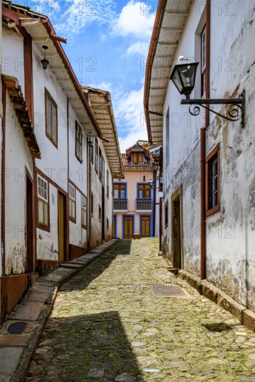 Alleyway with historical buildings in colonial style in the city of Ouro Preto, Minas Gerais, Ouro Preto, Minas Gerais, Brazil