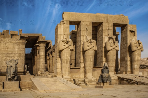 2nd courtyard with Osiris statues, head of a statue of Ramesses II in front of it, Ramesses II mortuary temple, Luxor, West Thebes, Egypt, Thebes, West