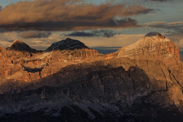 Steep mountains, mountain range, sunset, cloudy, autumn, Pordoi Pass, view of Tofana Group, Dolomites, Italy