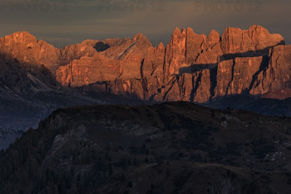 Steep mountains, mountain range, sunset, cloudy, autumn, Pordoi Pass, view of Croda da Lago, Dolomites, Italy