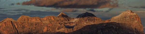 Steep mountains, mountain range, sunset, cloudy, panorama, autumn, Pordoi Pass, view of Tofana Group, Dolomites, Italy