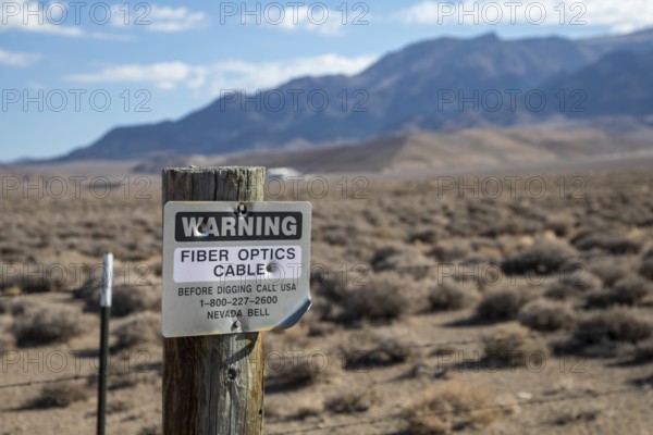 Round Mountain, Nevada - A sign warns of a buried fiber optic cable in the Nevada desert