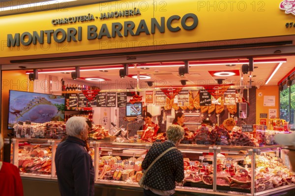 Market stall shop store selling butcher meat products inside Mercado Central de Zaragoza, Zaragoza, Aragon, Spain
