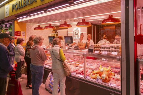 Market stall shop store selling chicken meat products inside Mercado Central de Zaragoza, Zaragoza, Aragon, Spain