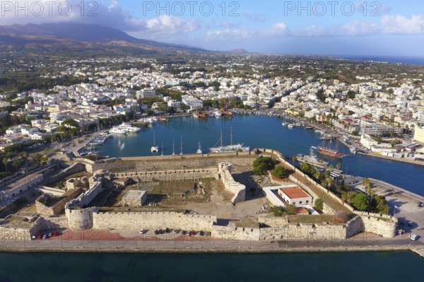Aerial view, below Kastro, Neratzia fortress, also Nerantzia, castle, first mentioned in 1395, formerly fortress of the Order of St. John, today ruin, above Mandraki harbor, yacht port, ship, ships, city of Kos, Dodecanese islands, Greece, eastern Adriatic, Mediterranean
