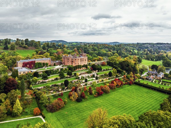 Autumn colours over Powis Castle and Garden from drone, Welshpool, Powys, Wales, England, United Kingdom