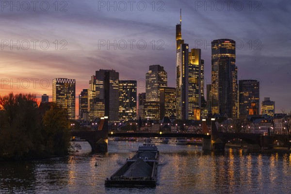 The lights of Frankfurt's banking skyline glow in the evening, Frankfurt, Hesse, Germany