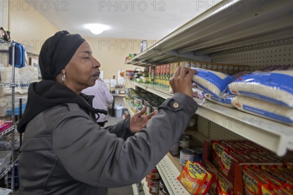 Detroit, Michigan USA - 4 November 2025 - People pick up groceries at the nonprofit Deo Gratias Food Pantry, operated by theFelician Sisters. Demand for emergency food at food pantries and soup kitchens has risen dramatically since the federal government shutdown cut SNAP benefits