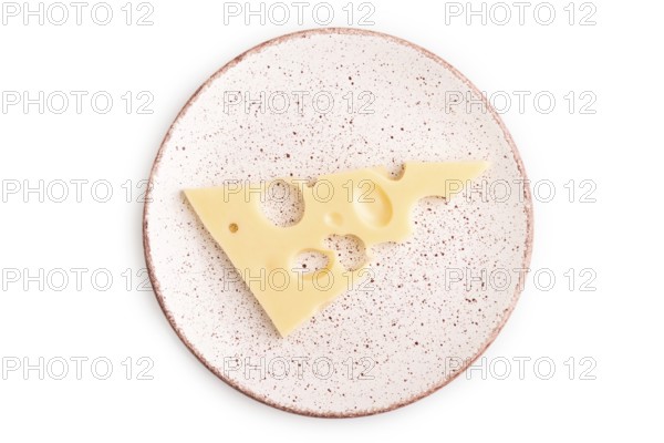 Piece of cheese with holes on plate isolated on white background, top view, flat lay, copy space, minimalism