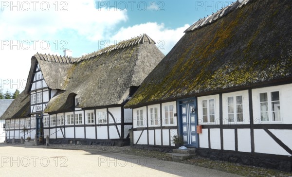 Danish inn, restaurant, in typical half-timbered house with thatched roof on Funen, Fyn island, Denmark, Scandinavia