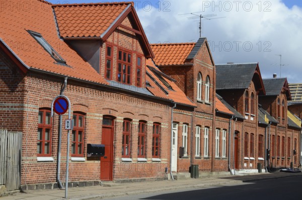 Row of brick houses along a street in Assens, Funen island, Denmark, Scandinavia