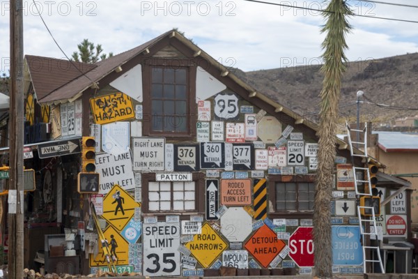 Goldfield, Nevada - An old house covered by road signs