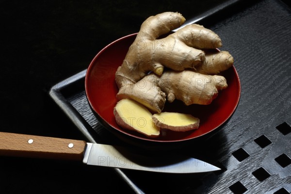 Ginger, ginger root in tea bowl, Zingiber officinale, tea preparation