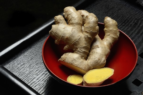 Ginger, ginger root in tea bowl, Zingiber officinale, tea preparation