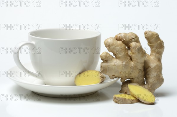Ginger root with cup, ginger tea