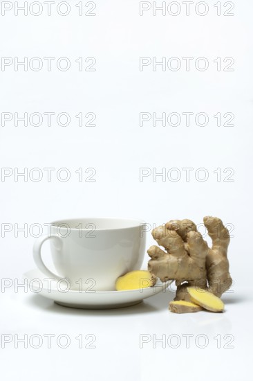 Ginger root with cup, ginger tea