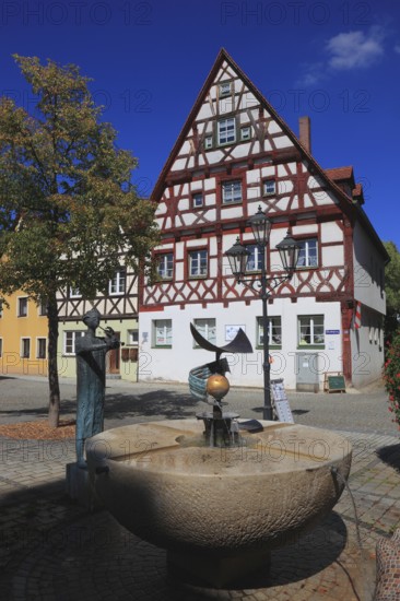 Half-timbered houses and fountains on Rathausplatz, city of Heideck in the district of Roth, Middle Franconia, Bavaria, Germany