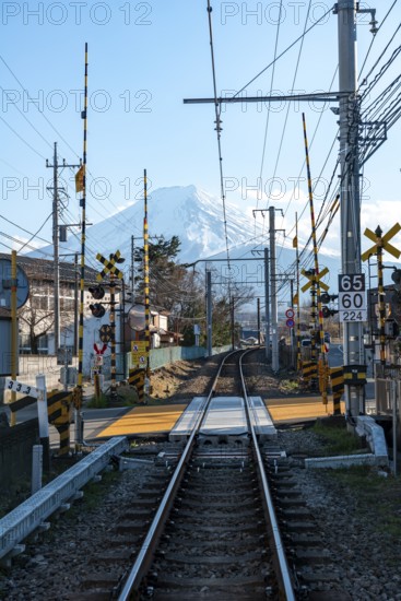 Rails of a railway line, behind Vulkan Mt. Fuji, Fujiyoshida, Yamanashi Prefecture, Japan