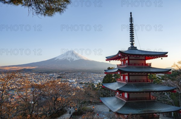 Five-story pagoda of a Shinto Shrine, Chureito Pagoda, with views of Fujiyoshida City and Mount Fuji volcano at sunset, Arakura Fuji Sengen Shrine, Arakurayama Sengen Park, Yamanashi Prefecture, Japan