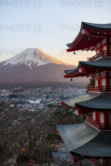 Five-story pagoda of a Shinto Shrine, Chureito Pagoda, with views of Fujiyoshida City and Mount Fuji volcano at sunset, Arakura Fuji Sengen Shrine, Arakurayama Sengen Park, Yamanashi Prefecture, Japan