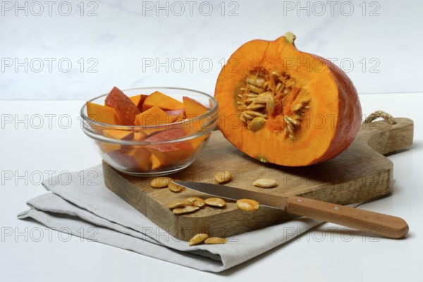 Hokkaido pumpkin, sliced with a knife