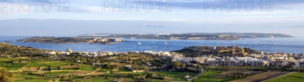 Panoramic view of three islands in the Mediterranean from the state of Malta in front island of Gozo in the middle small island of Comino in the background large island of Malta, Malta