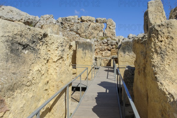 View from secured walkway with railing through ruins remains of Ggantija temple, UNESCO World Heritage Site, Gozo, MaltagGantija temple, UNESCO World Heritage Site, Gozo, Malta