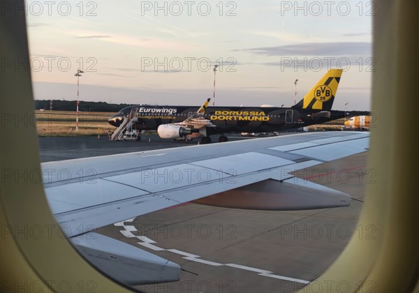 View from an airplane of the runway with the Borussia Dortmund crew airbus, airport, Düsseldorf, North Rhine-Westphalia, Germany