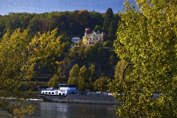 Marienfels Castle with cargo ship on the Rhine River, former residence of entertainer Thomas Gottschalk, Remagen, Rhineland-Palatinate, Germany