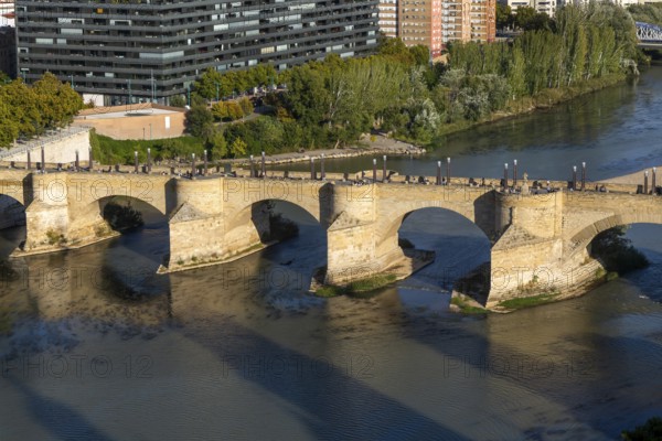 View looking down of historic Stone Bridge, Puente de Piedra, spanning the River Ebro, Zaragoza, Aragon, Spain