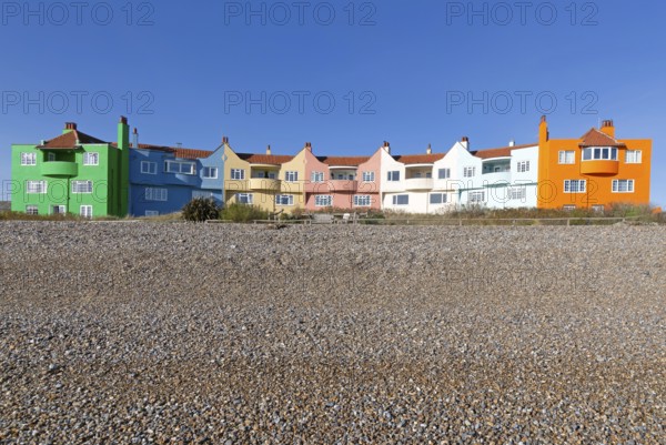Colourful 1930s seaside houses called The Headlands on the beach at Thorpeness, Suffolk, England, UK