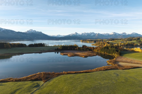 Landscape with a quiet lake surrounded by mountains and autumn vegetation, Illasbergsee, Forggensee, near Roßhaupten, Ostallgäu, Allgäu, Swabia, Bavaria, Germany