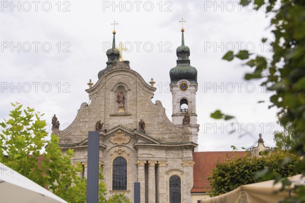Baroque church with distinctive towers and sculptures against a cloudy sky, ZFP Zwiefalten, Reutlingen district, Germany
