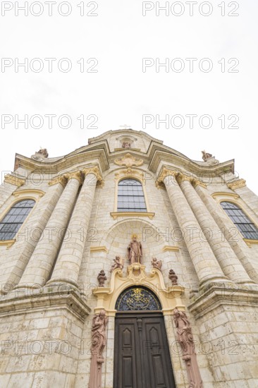 Majestic baroque church façade with tall columns and decorated entrance, ZFP Zwiefalten, Reutlingen district, Germany