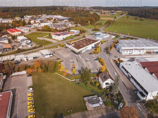 An industrial area in autumn with wide roads and autumn trees in a rural area, Althengstett, Calw district, Germany