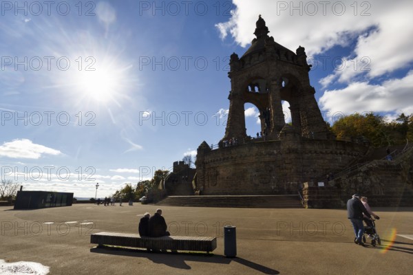 Kaiser Wilhelm Memorial, national monument with dome, landmark, sunny autumn weather, back light, sun rays, visitors on viewing platform, Porta Westfalica, Ostwestfalen-Lippe, East Westphalia, North Rhine-Westphalia, Germany