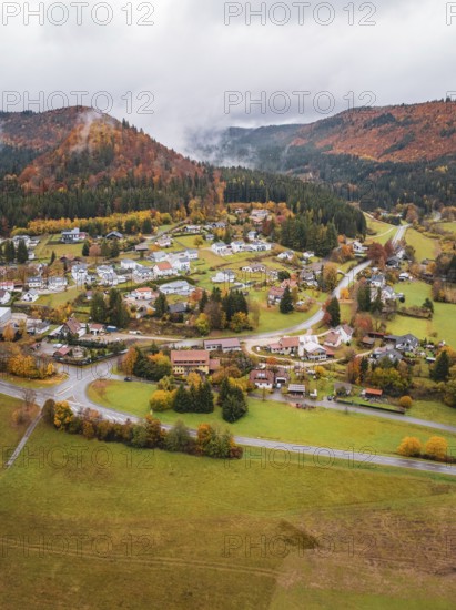 Small village in a hilly autumn landscape surrounded by fog, Wehingen, Tuttlingen district, Germany