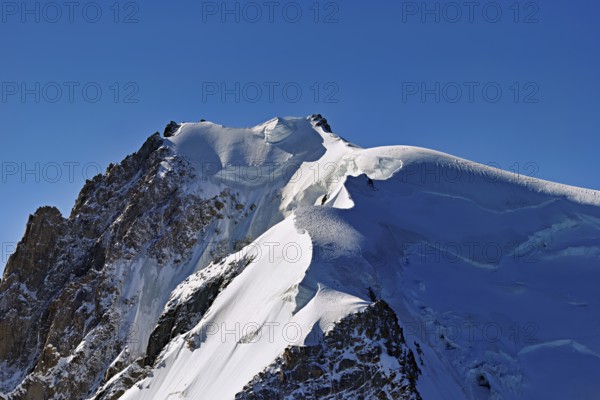 View of the snow-covered Mont Blanc du Tacul from the Aiguille du Midi, Chamonix-Mont-Blanc, Haute-Savoie, France