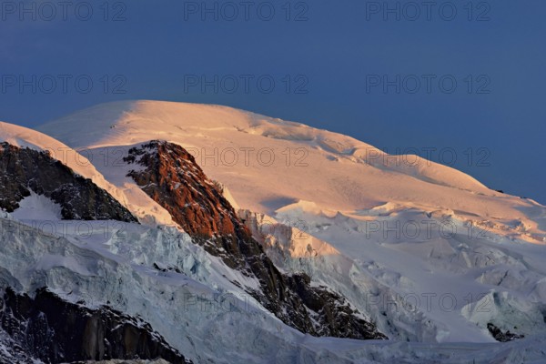 Snow-covered Mont-Blanc in the light of the setting sun, Chamonix-Mont-Blanc, Haute-Savoie, France