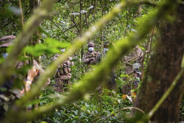 Soldiers, rangers in the jungle, guarding chimpases in the jungle, animal welfare, Kibale National Park, Uganda