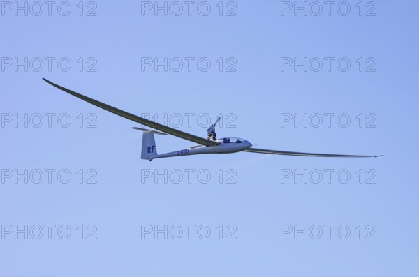 A Schempp-Hirth Nimbus 3MR motor glider, registration D-KERF, during a screening as part of an air show at the Rossfeld Air Sports Association on Rossfeld in Metzingen-Glems, Baden-Württemberg, Germany, for editorial use only