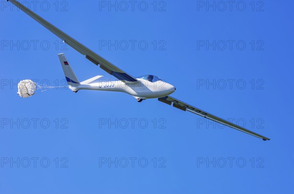 A Hänle H-101 somersault glider, registration D-3033, during a demonstration as part of an air show at the Fliegerbergfest of the Rossfeld Luftsportverein in Metzingen-Glems, Baden-Württemberg, Germany, for editorial use only