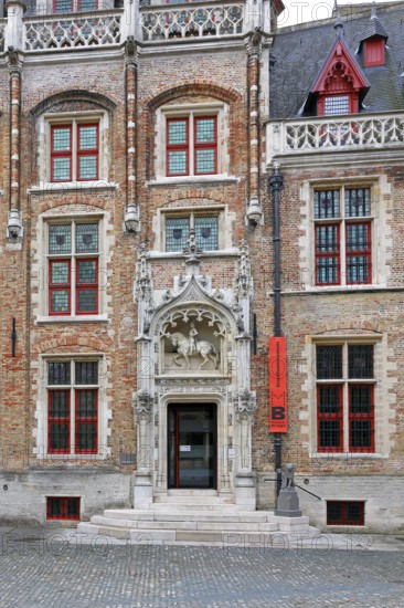 Gruuthusemuseum with equestrian statue of Lodewijk van Gruuthuse above the entrance portal in the historic old town of Bruges, UNESCO World Heritage Site, Flanders, Belgium