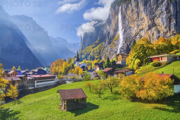 View of town and valley with Staubbach waterfall in autumn, Lauterbrunnen, Bernese Oberland, Canton of Bern, Switzerland