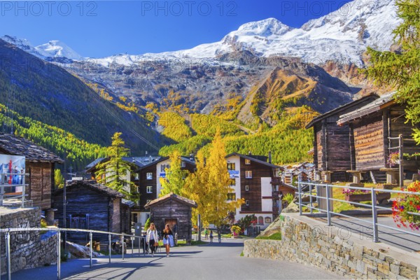 Typical granaries on the outskirts of the village with Allalin 4027m and Alphubel 4206m in autumn, Saas-Fee, Saasertal, Valais, Switzerland