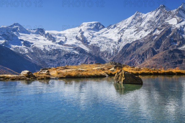 Kreuzbodensee with Alalin 4027 m, Alphubel 420 6 m and Mischabel Group 4545 m in autumn, Saas-Grund, Saasertal, Valais, Switzerland