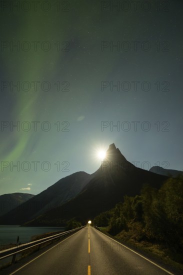National mountain of Norway - Stetind in the Nordland under auroras and a full moon