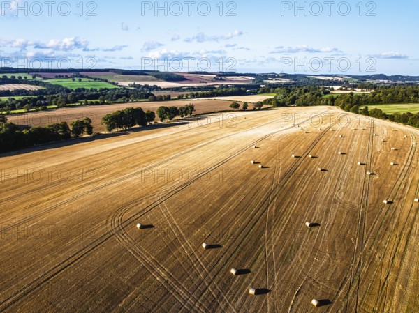 Straw bales in the Scottish fields from a drone, Southeast Scotland, UK